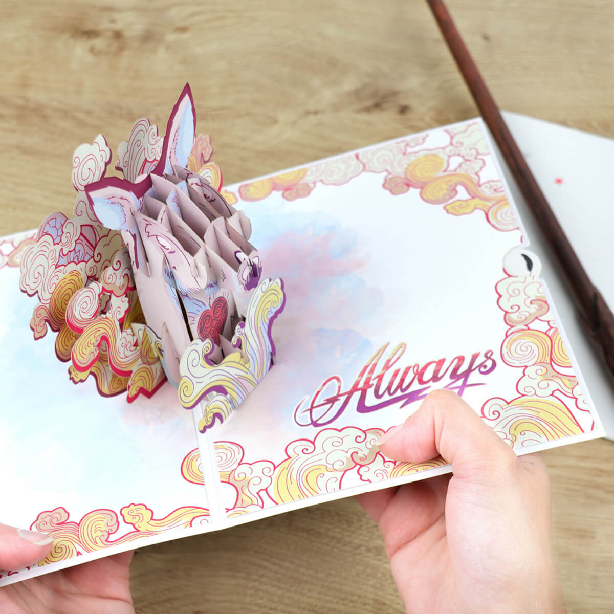 HarryPotterValentinesDayPatronusPopUpCard_CardsHolding.jpg